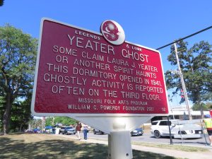 A placard outside of Yeater Hall gives information about the Yeater Hall Ghost. The placard was created by the Missouri Folk Arts Program.