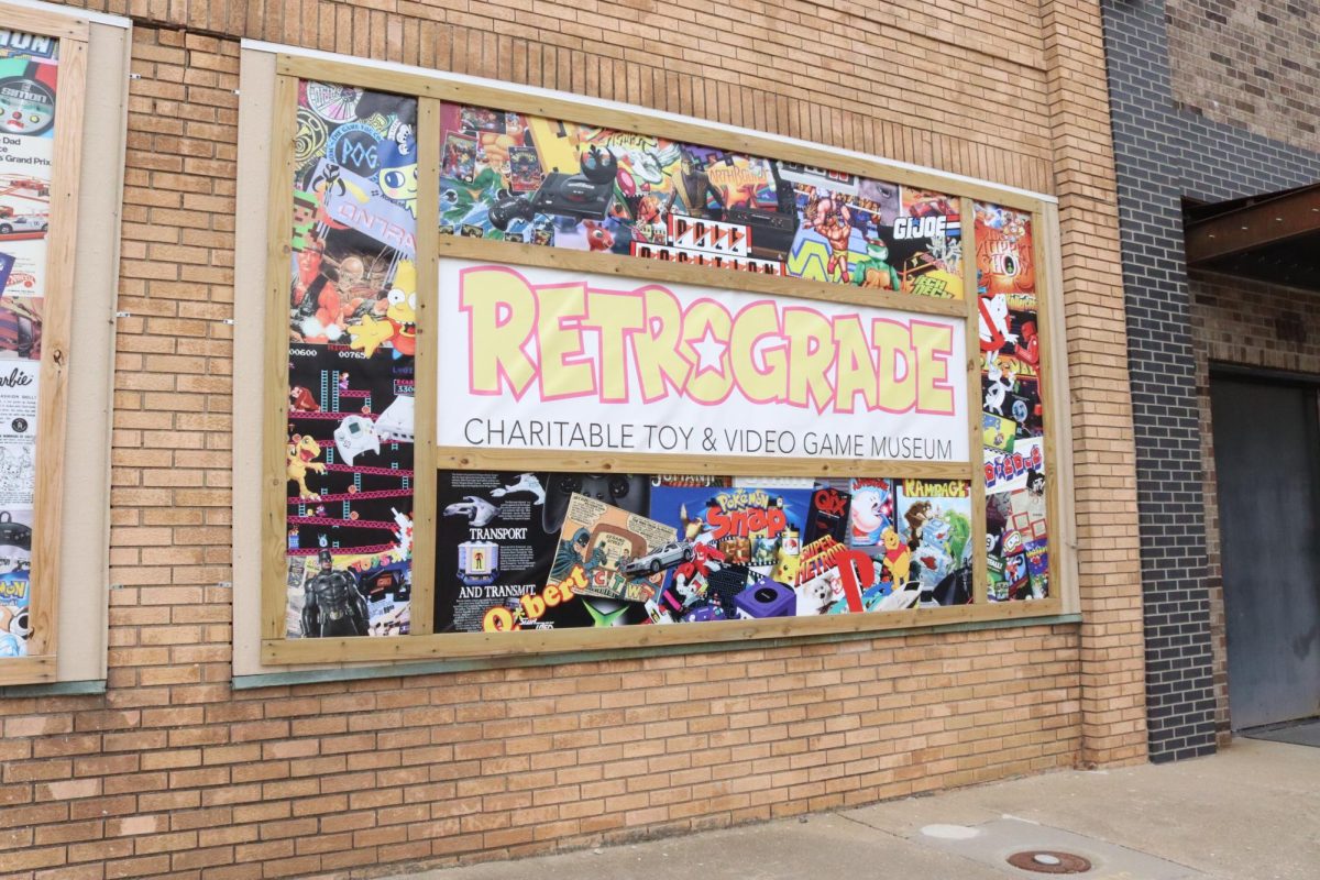 A mural on the outside of the building that houses Retrograde Charitable Toy and Videogame Museum shows various pop culture references. Retrograde not only features a museum, but also an arcade in which patrons are allowed to play as part of their admission price.