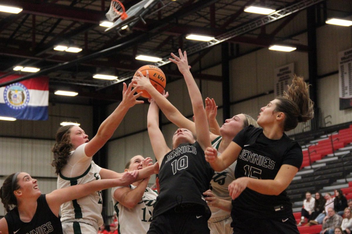 Junior Rylee Vierthaler and freshman Makenzie Farmer fight for control of the ball against Northwest Missouri State players on Jan. 23 at the Jerry M. Hughes Athletic Center. Jennies Basketball won 77-59.