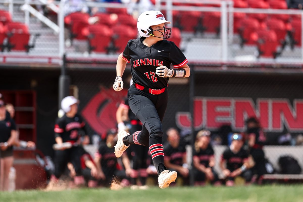 Jennies utility player senior Jadyn Sheffield runs to base after hitting the ball. Sheffield won the Gold Glove Award in 2025.