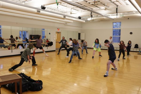 Members of the fencing club warm up in practice room M166 in the Student Recreation and Wellness Center at UCM on April 2. The fencing club is open to all UCM students.