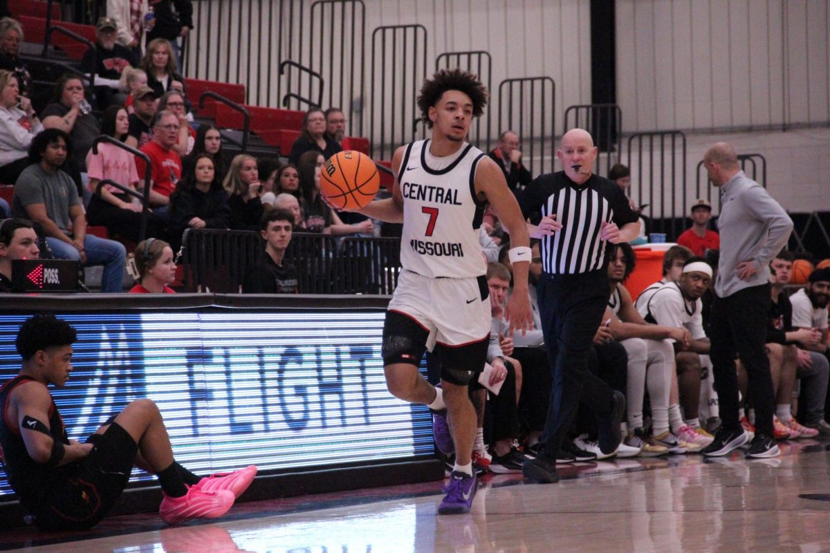 Freshman Lazerek Houston dribbles the ball up the court, looking to pass to a fellow teammate during the UCM basketball game against Pittsburg State located in the Jerry M. Hughes Athletics Center. The Mules won the February 28 game, with a final score of 78-61.