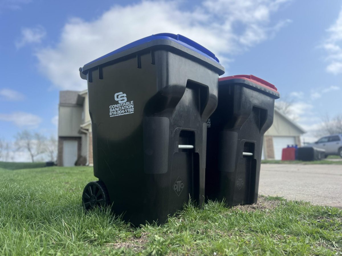A new garbage and recycling bin sit outside of Pine Court. The City of Warrens-burg has contracted with the solid waste disposal service Constable Sanitation, Inc., providing the opportunity for residents to recycle starting March 1.